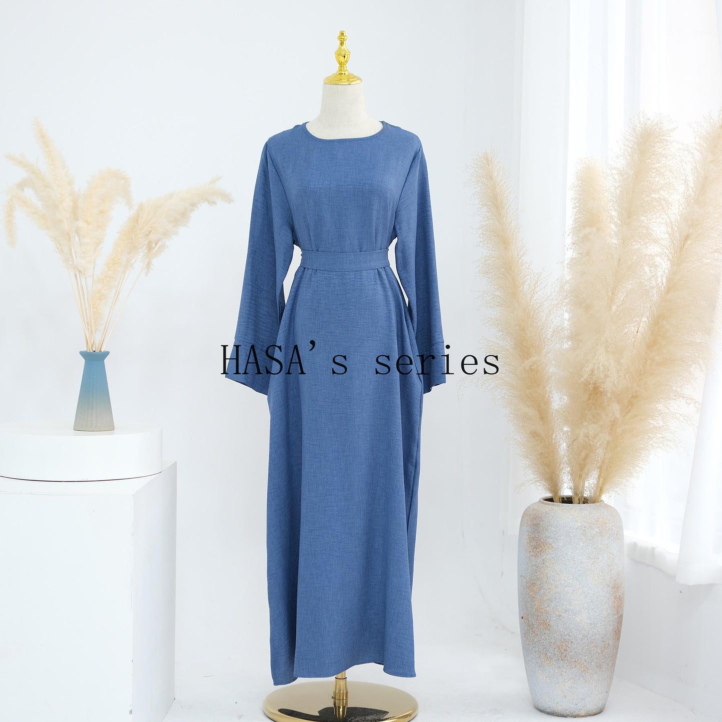 HS4848 A simple, waist-cinching spring/summer dress with a relaxed, long design.