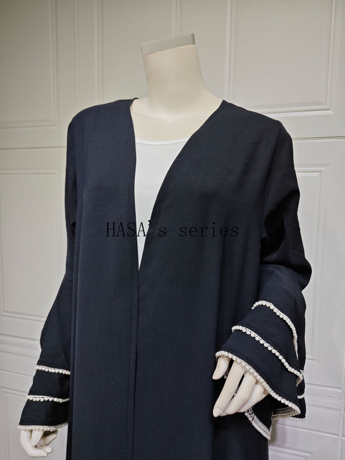 HS5093 Elegant black cardigan-style long robe with wide sleeves and a round-neck dress design featuring beaded embellishments.