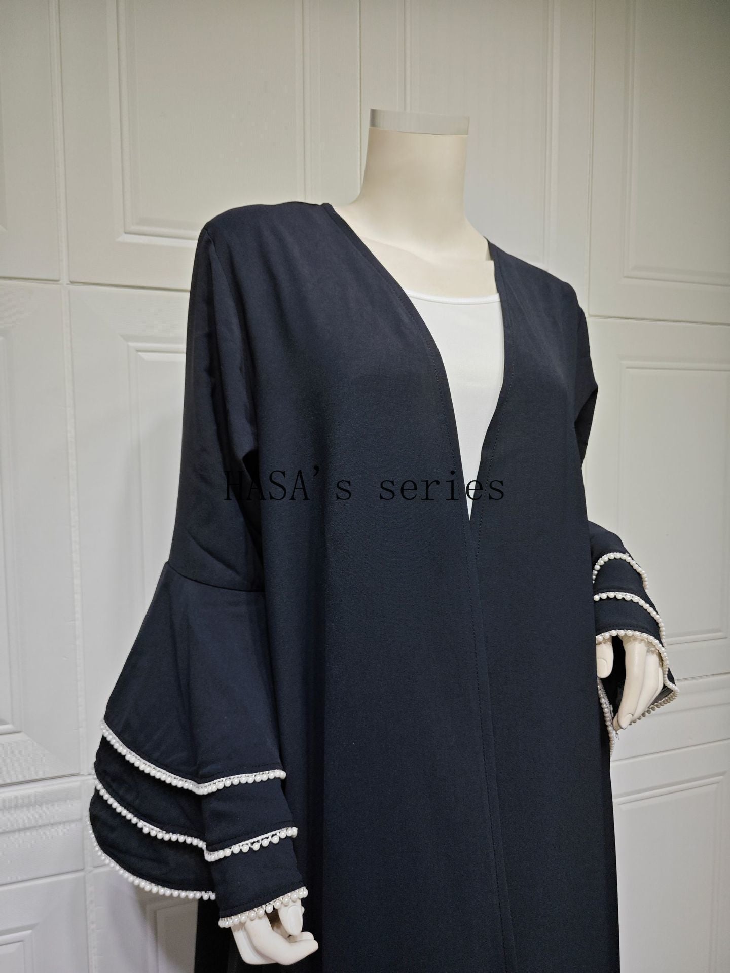 HS5093 Elegant black cardigan-style long robe with wide sleeves and a round-neck dress design featuring beaded embellishments.