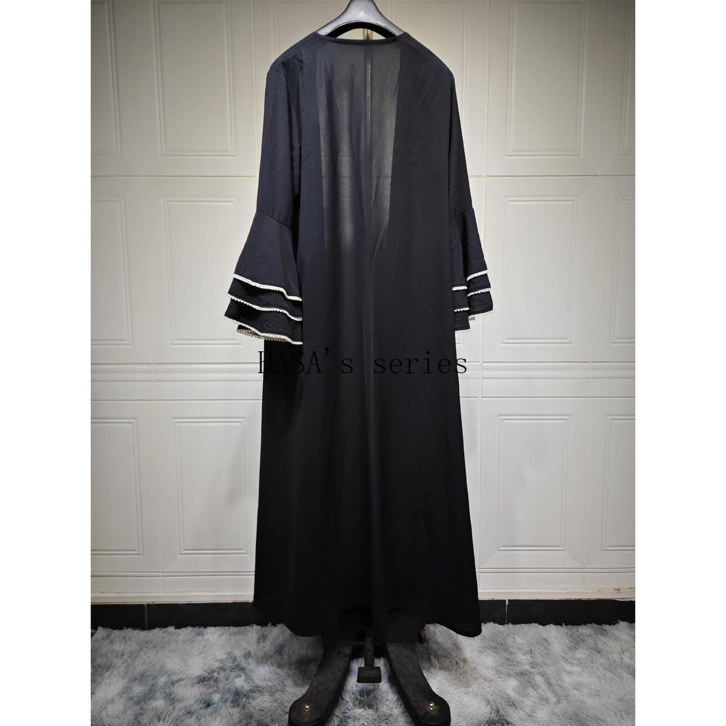 HS5093 Elegant black cardigan-style long robe with wide sleeves and a round-neck dress design featuring beaded embellishments.