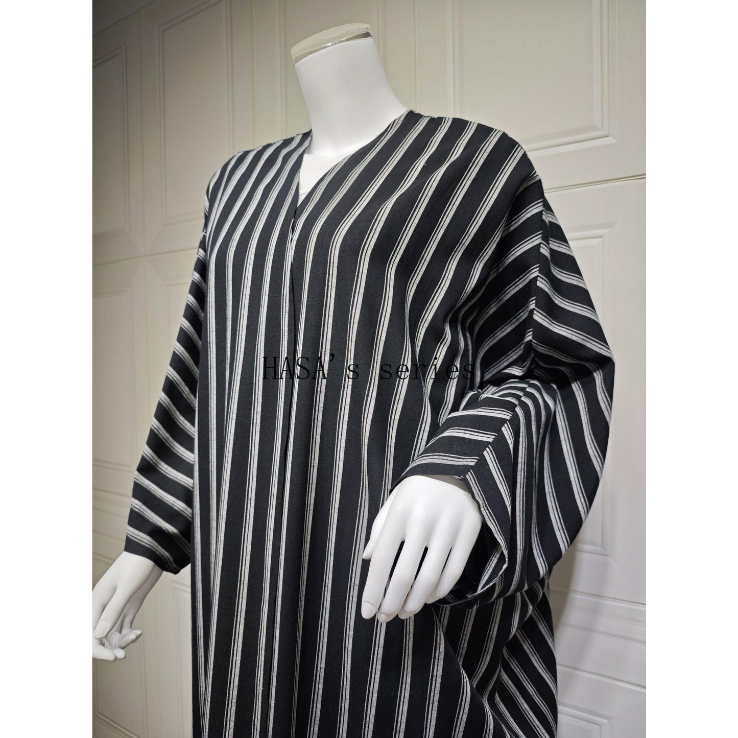 HS5096 Stylish Black and White Striped Long Coat with A Loose-fitting, Open-front Design.