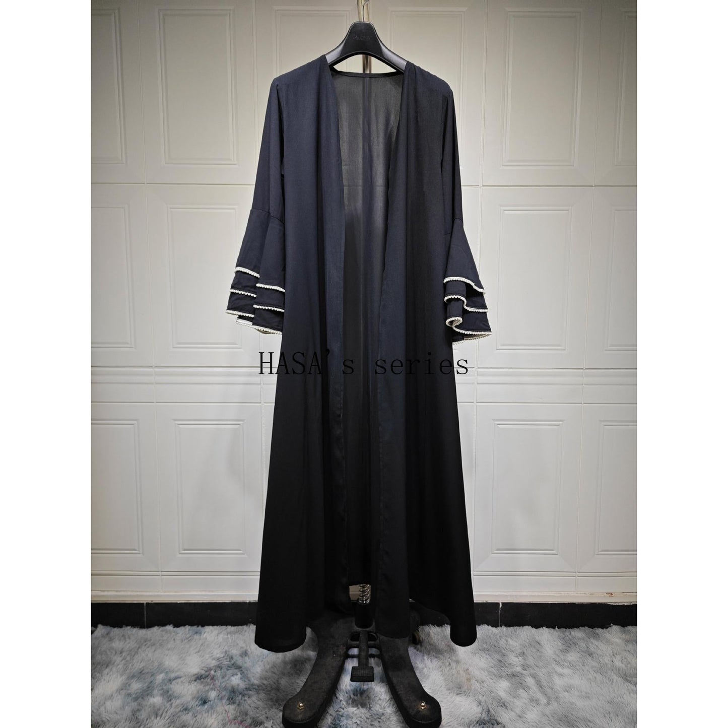 HS5093 Elegant black cardigan-style long robe with wide sleeves and a round-neck dress design featuring beaded embellishments.