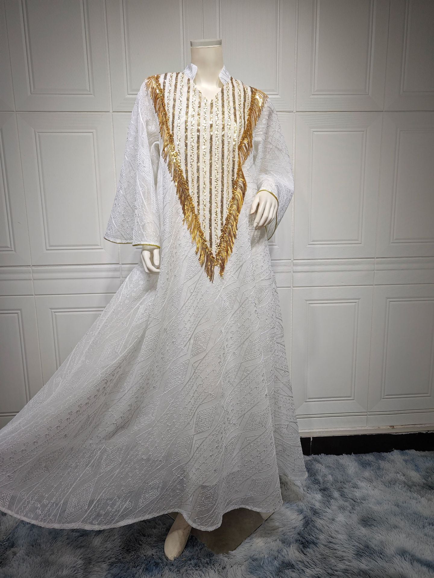 HA6648 A long robe with mesh sequins and embroidered details; an elegant and sophisticated dress.