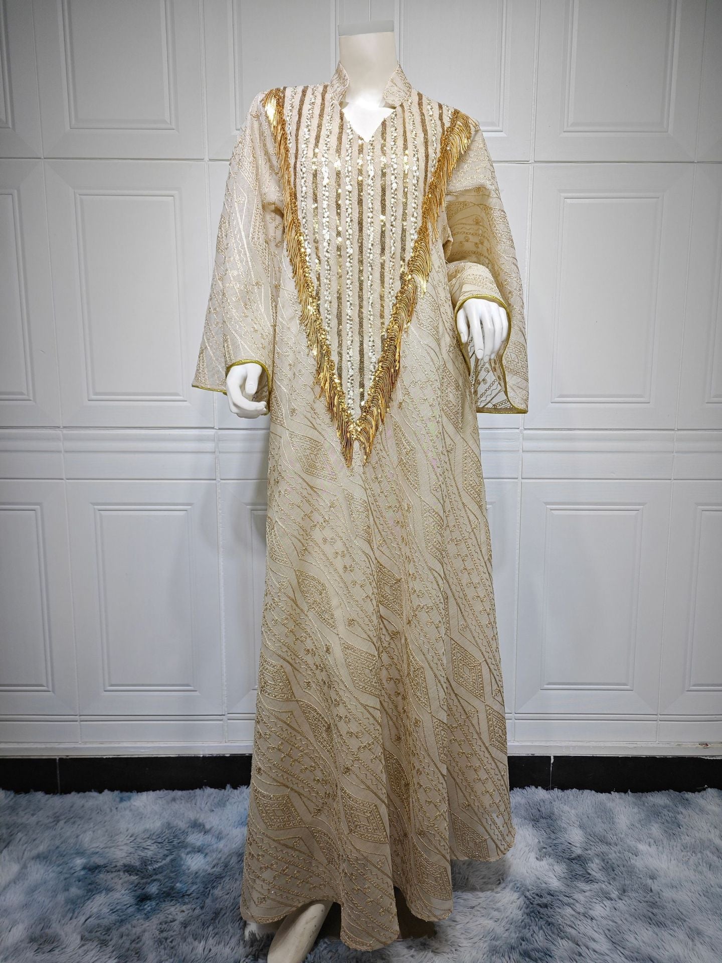 HA6648 A long robe with mesh sequins and embroidered details; an elegant and sophisticated dress.