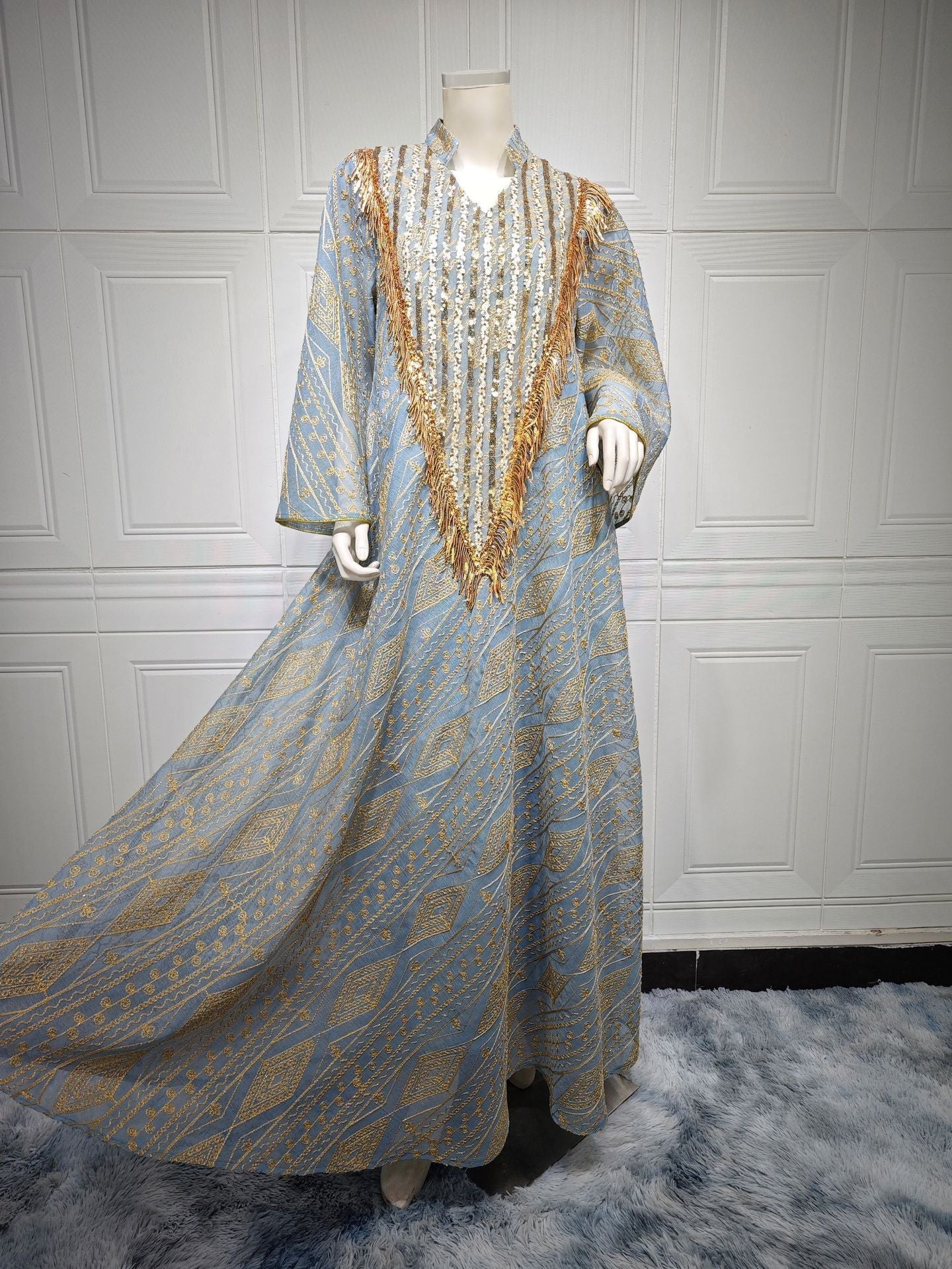 HA6648 A long robe with mesh sequins and embroidered details; an elegant and sophisticated dress.