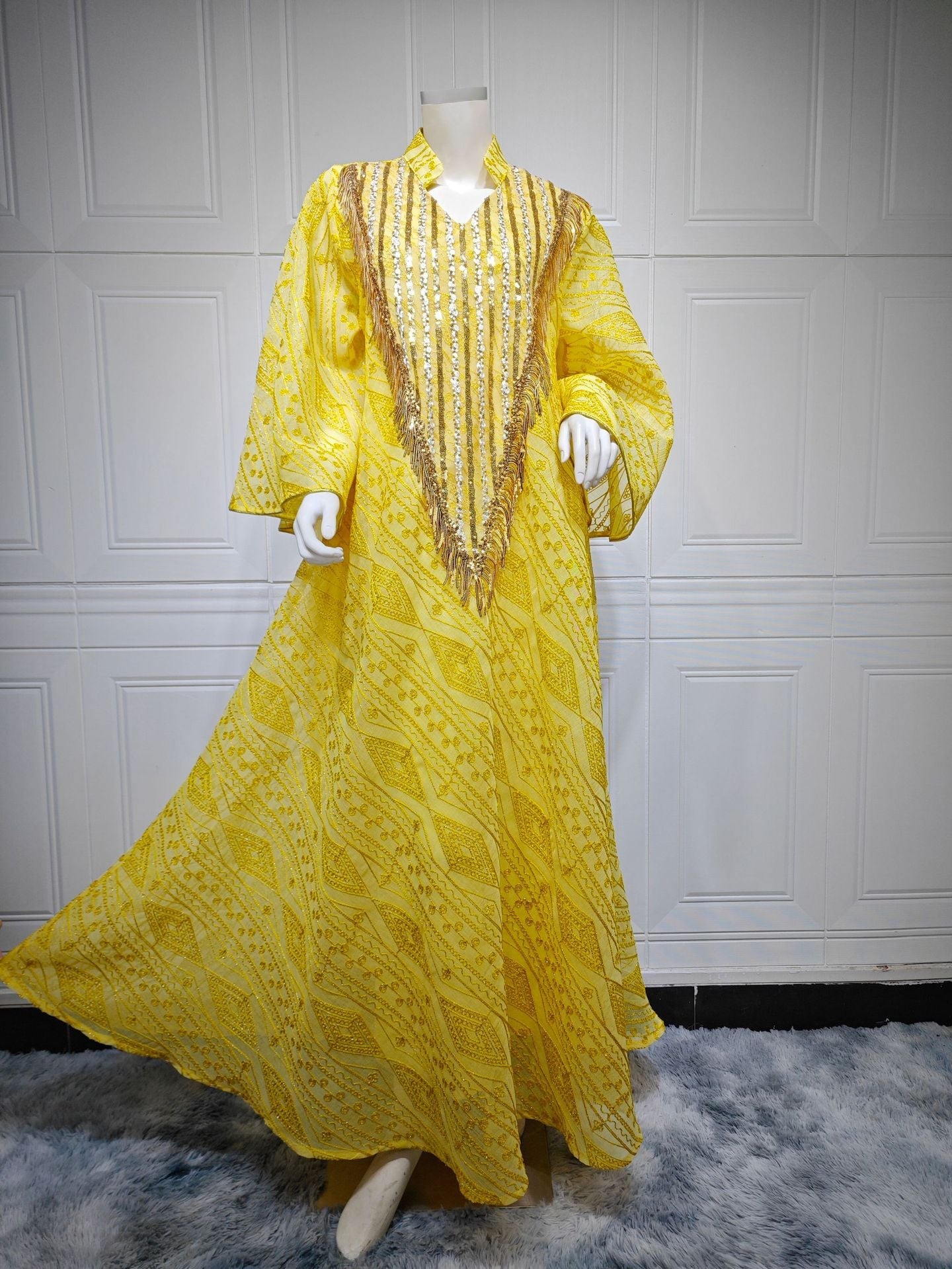 HA6648 A long robe with mesh sequins and embroidered details; an elegant and sophisticated dress.
