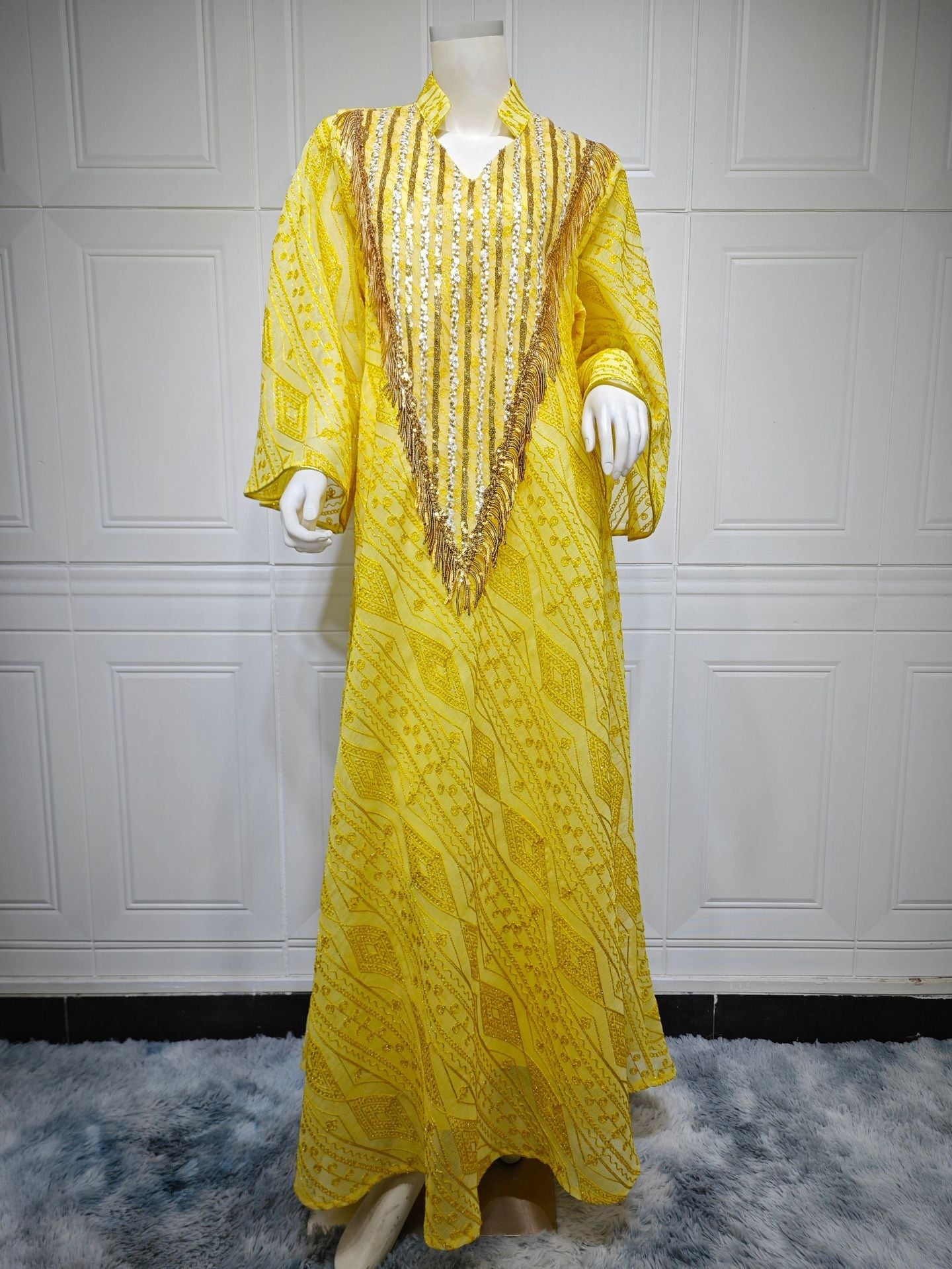 HA6648 A long robe with mesh sequins and embroidered details; an elegant and sophisticated dress.