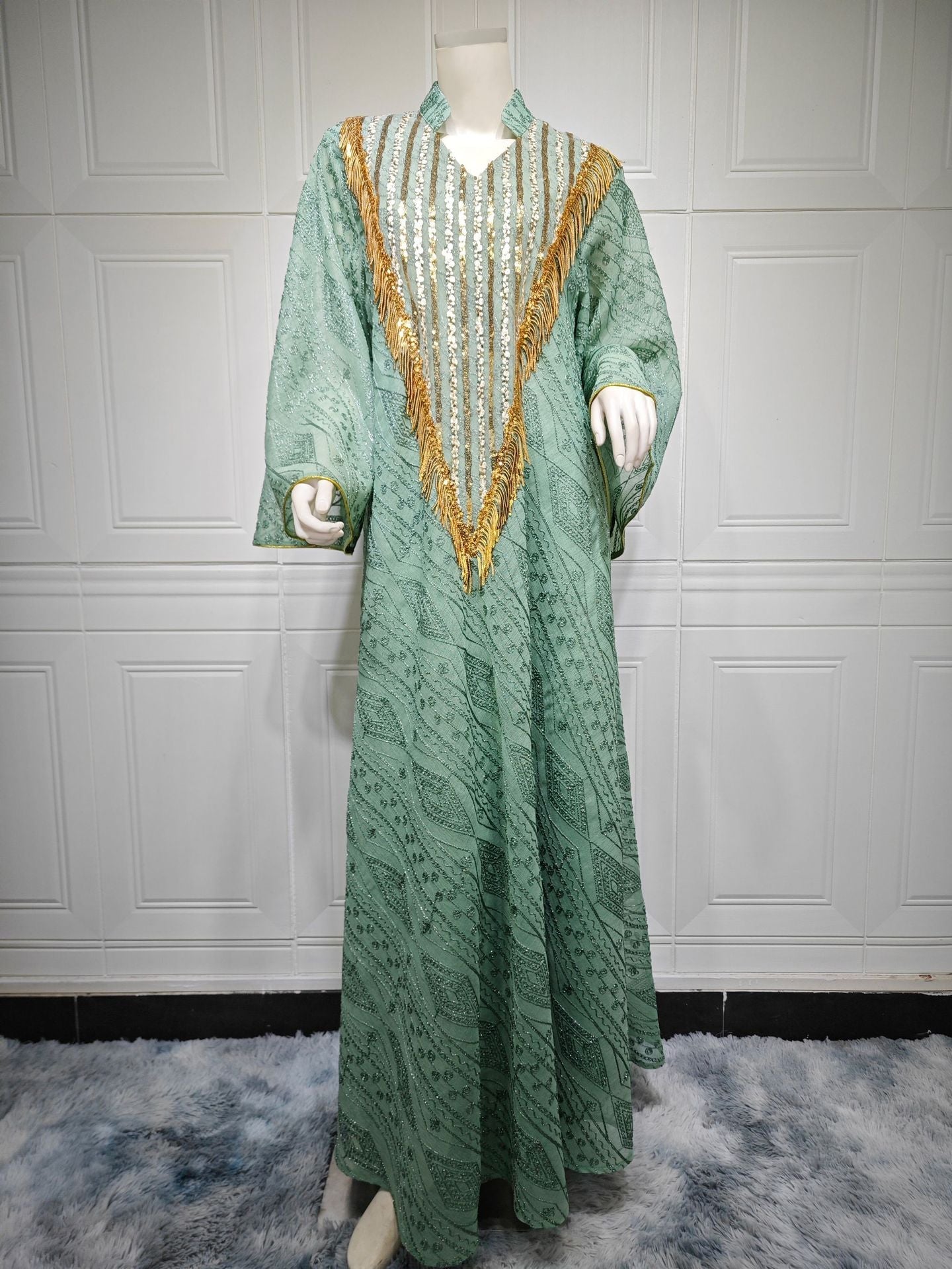 HA6648 A long robe with mesh sequins and embroidered details; an elegant and sophisticated dress.