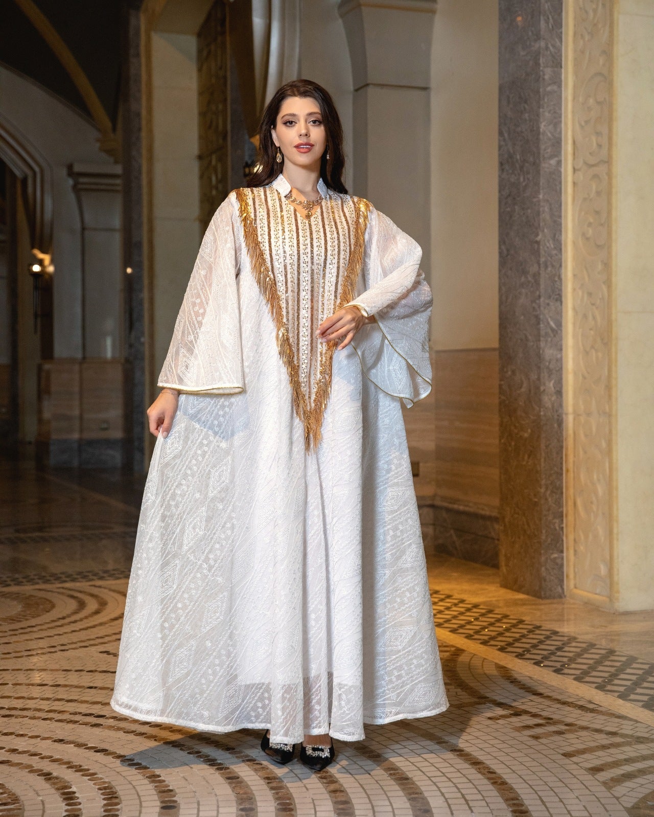 HA6648 A long robe with mesh sequins and embroidered details; an elegant and sophisticated dress.