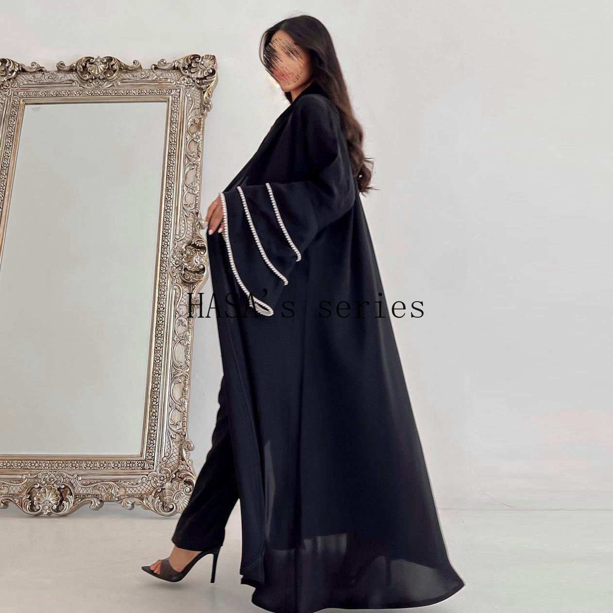 HS5093 Elegant black cardigan-style long robe with wide sleeves and a round-neck dress design featuring beaded embellishments.